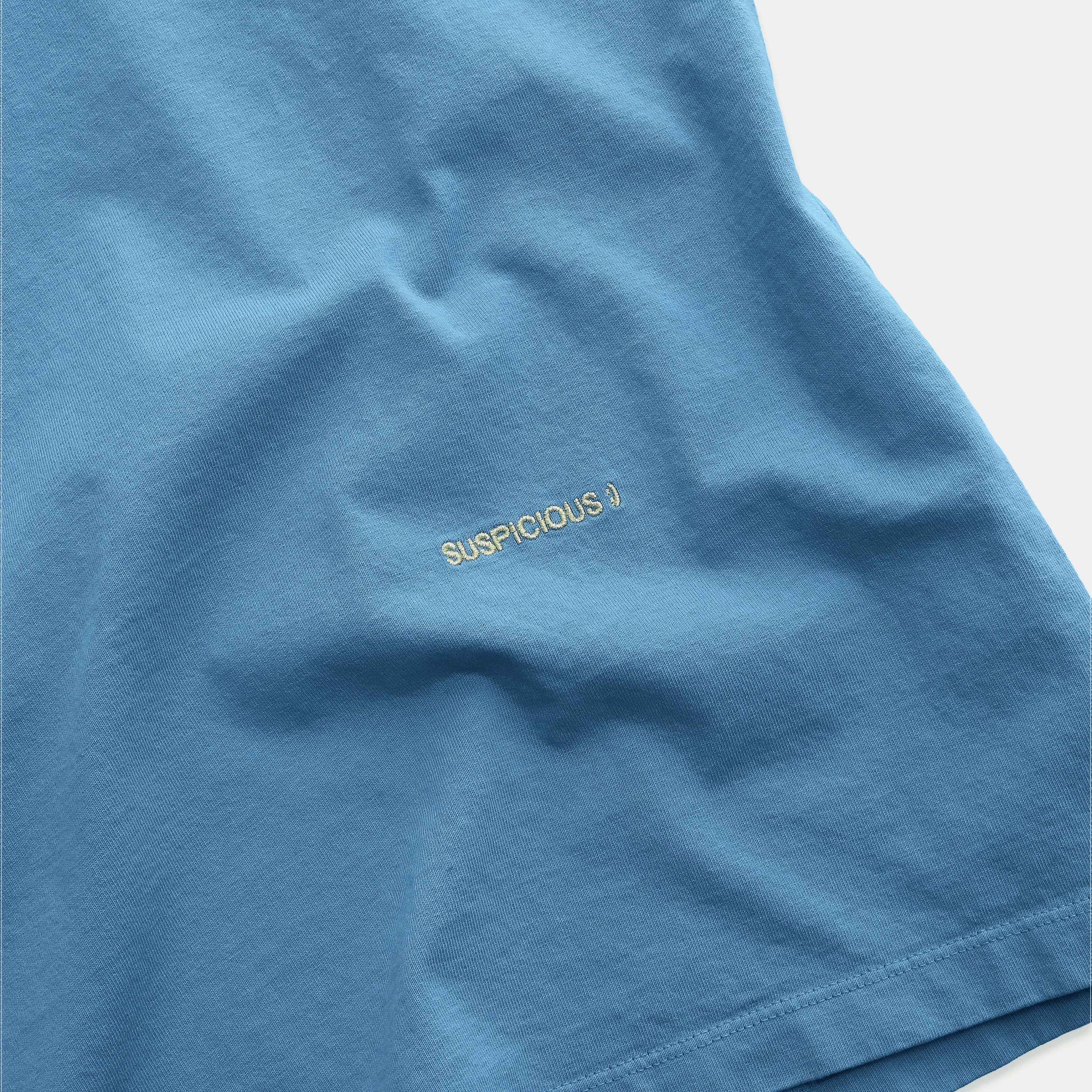 The Suspicious Smiley Tee - Mineral Blue - Image 4
